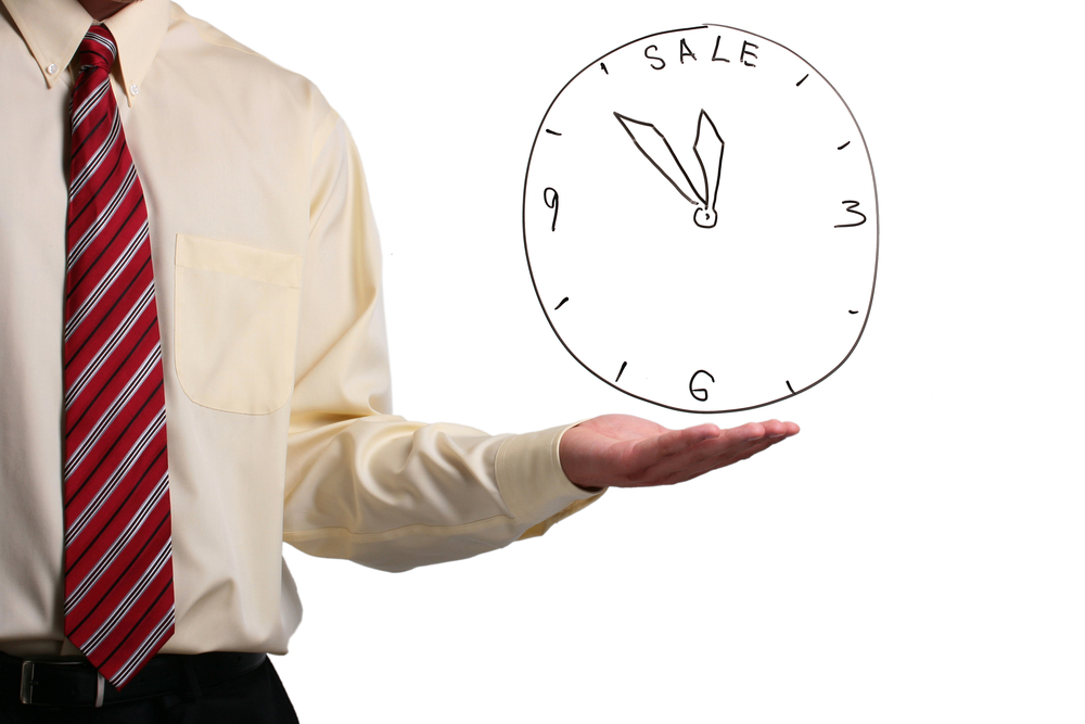 Man holding a clock