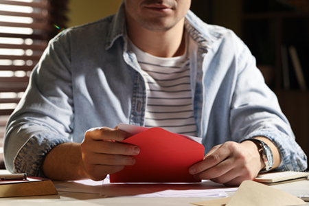 Man opening greeting card