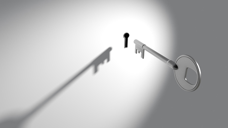 silver key entering keyhole